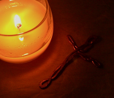 Candle and copper cross